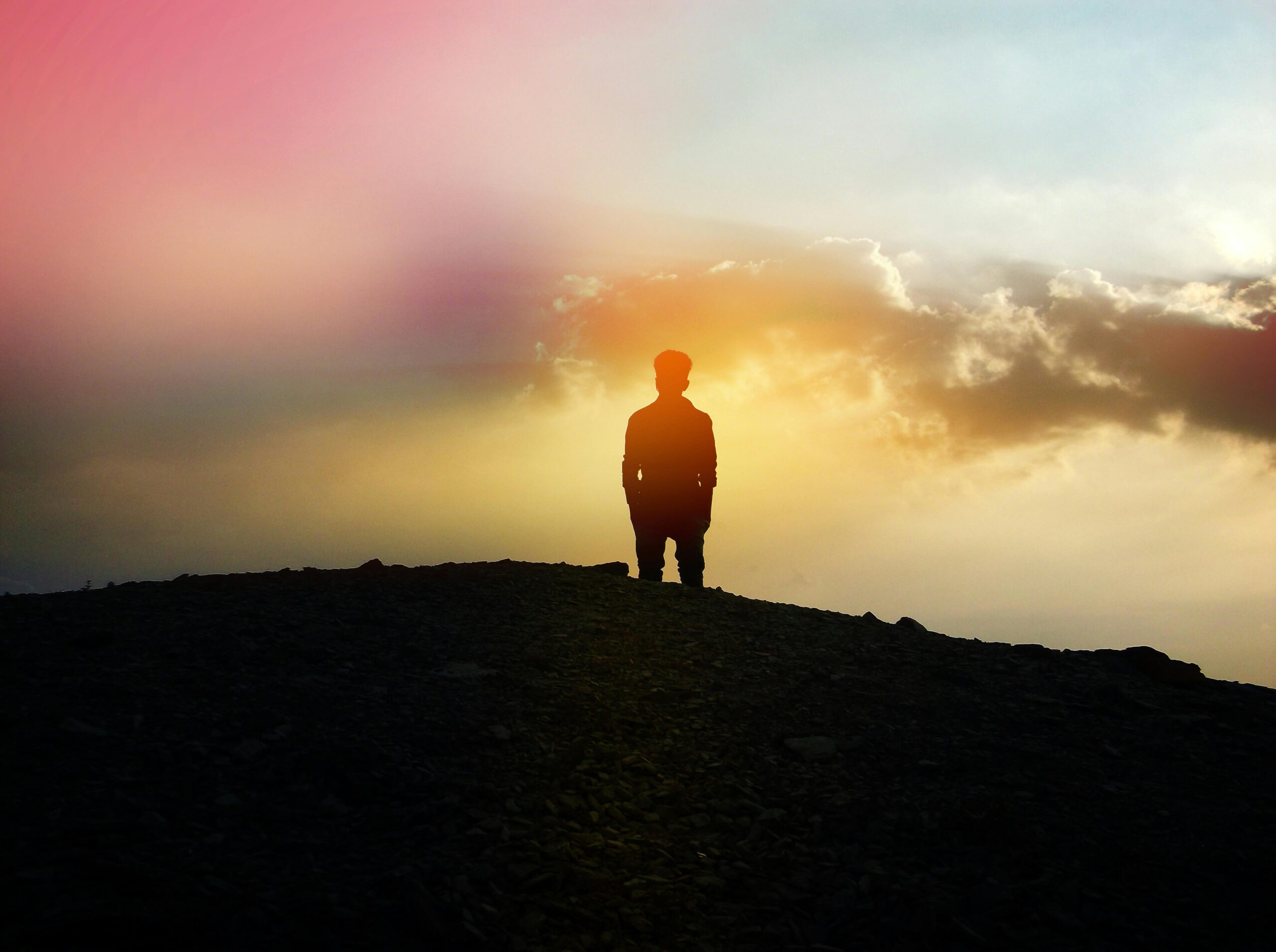 Silhouette Image of a Man Staring Into the Sky.